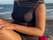 Preview 1 of Girl with hard nipples masturbating on public beach