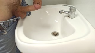 pissed and jerked off in the sink in a public toilet