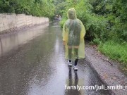 Preview 2 of Teen in yellow raincoat flashes pussy outdoors in the rain