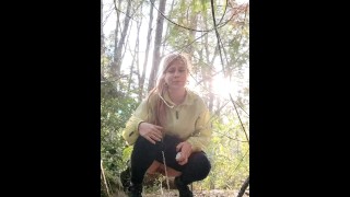 Peeing girl in the forest