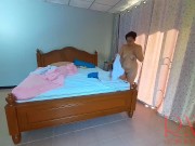 Preview 4 of Nudist housekeeper Regina Noir makes the bedding in the bedroom. Naked maid. Naked housewife. c2