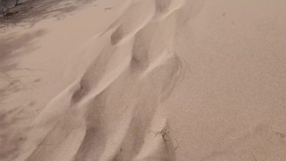 Tour guide in the middle of desert outdoors is watched while she pees on sand in public open pussy