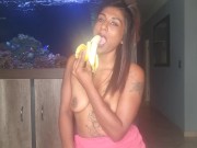 Preview 1 of Topless desi squeezes her boobs as she sucks and deepthroats on a banana