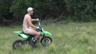 Naked man riding a Dirt bike