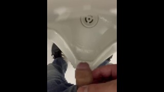 Peeing in a male toilet bowl