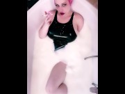 Preview 3 of Pink haired Luvie Doll smoking EVE 120 cigarette in PVC swimsuit in a milk bath in her bathtub