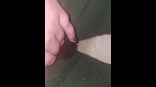 Trans guy slowly pissing in green boxers