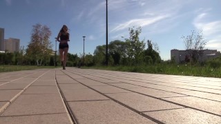 SFW. A girl in a sexy suit is engaged in fitness. Running and squats