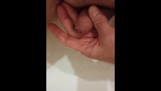 Pissing in the bathroom in my palm and jerking off my dick to the boner.