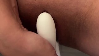 Girl fucks guy in anal with a strapon, close-up from below