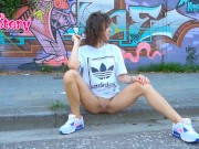 Preview 2 of Quick street pee of an appetizing brunette