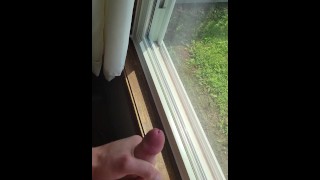 Twink boy cumming in front of the window while almost blowing his load prematurely =p