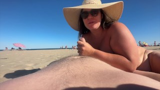 fucking on a nudist beach while a horny audience watches her big cock cum on her ass