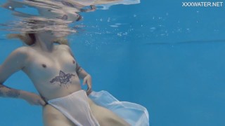 Petite Russian Marfa swims nude in the pool