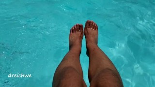 Feet in the pool with a lot of water