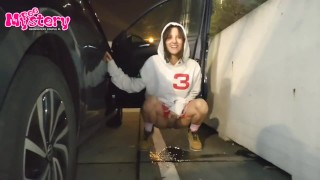 Crazy college girl pees in the parking lot of the store