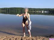 Preview 1 of Sexy girl undresses and swims naked in public beach