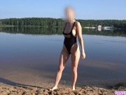 Preview 2 of Sexy girl undresses and swims naked in public beach