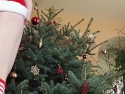 Preview 1 of Redhead rides a dildo by the Christmas tree
