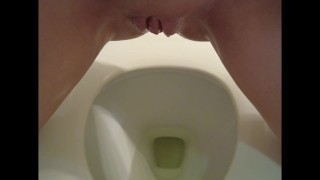 Oily Bald Pussy Dripping Pee in Toilet