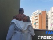 Preview 2 of The legend of muscles and ink: Tattooed giant Rob Diesel, shows his power on the balcony