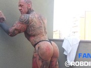 Preview 6 of The legend of muscles and ink: Tattooed giant Rob Diesel, shows his power on the balcony