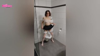 Party girl pees in the toilet