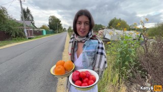 A village girl offered fruit and showed her garden