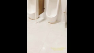 Chinese ladyboy opens the door while cumming in public toilet