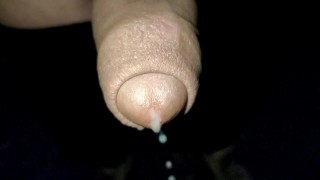 Close up slow motion - Cum dripping out of uncut cock