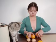 Preview 1 of Sexy busty beauty shows off her cooking skills, making orange egg tarts