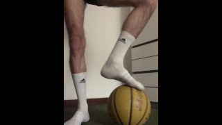 hairy young sportsman in white adidas socks jerks off in his room after playing basketball