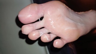 Eating cum off her oily soles after worshipping them