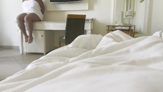 Stepmom shares a bed with her stepson in a hotel room