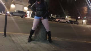 Dirty femboy takes long risky pee in mall parking lot