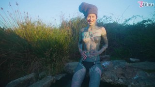 Alternative couple having wild outdoor sex in outdoor hot spring