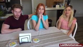 A redhead and a blonde lose a strip game and fuck the male winner