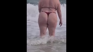 Big booty blonde playing on the beach